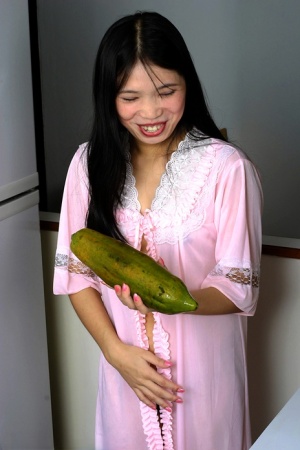 Asian gal sucking a big fat sex toy